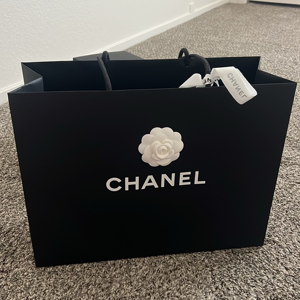 Chanel paper shopping bag with camellia and white ribbon
